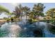Beautiful pond with a fountain surrounded by mature trees, offering a serene and peaceful setting at 1625 W Gunstock Loop, Chandler, AZ 85286