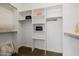 Walk-in closet with built-in shelving and clothing rods for organization at 1625 W Gunstock Loop, Chandler, AZ 85286