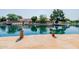 Scenic waterfront property with a brick patio, charming wooden posts, and stunning lake views at 1625 W Gunstock Loop, Chandler, AZ 85286