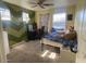 Fun bedroom with chevron accents and blue patterned comforter at 17335 W Woodlands Ave, Goodyear, AZ 85338