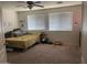 Bedroom filled with natural light and including two large windows at 17335 W Woodlands Ave, Goodyear, AZ 85338