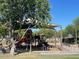 Community playground with covered play area and modern bicycle rack provides Gathering recreation at 17335 W Woodlands Ave, Goodyear, AZ 85338
