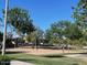 Community volleyball court has two nets for friends to gather and play in this recreation area at 17335 W Woodlands Ave, Goodyear, AZ 85338