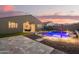 Enjoy the Arizona evenings in this backyard with new pool, rock landscaping and covered patio with outdoor dining at 18630 W Lawrence Ln, Waddell, AZ 85355