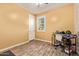 Bedroom with wood-look floors, a window with blinds, and a ceiling fan at 18630 W Lawrence Ln, Waddell, AZ 85355