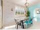 Bright dining room featuring modern decor, stylish seating, and a unique light fixture at 18630 W Lawrence Ln, Waddell, AZ 85355