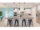 Beautiful kitchen features a large island, stainless steel appliances, and pendant lighting at 18630 W Lawrence Ln, Waddell, AZ 85355