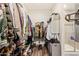 Walk-in closet featuring ample storage space with clothing racks and shelving at 18630 W Lawrence Ln, Waddell, AZ 85355