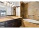 A bathroom showcasing a soaking tub and walk-in shower with designer tile surround at 19777 N 76Th St # 3220, Scottsdale, AZ 85255