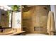 Bathroom view with decorative mirror and walk-in shower with beautiful tile work at 19777 N 76Th St # 3220, Scottsdale, AZ 85255