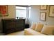 Relaxing bedroom with a dresser, sofa, artwork, and bright natural light at 19777 N 76Th St # 3220, Scottsdale, AZ 85255