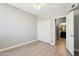 Neutral bedroom with plank flooring, closet, ceiling fan, and ensuite bathroom at 19777 N 76Th St # 3220, Scottsdale, AZ 85255