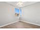 Clean, bright bedroom with hardwood floors and a large window, offering a comfortable retreat at 19777 N 76Th St # 3220, Scottsdale, AZ 85255