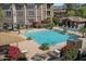 Aerial view of community pool, outdoor lounging area, and mature landscaping at 19777 N 76Th St # 3220, Scottsdale, AZ 85255