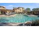 Resort-style pool with lounge chairs and cabanas overlooking the community buildings at 19777 N 76Th St # 3220, Scottsdale, AZ 85255