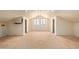 Attic interior featuring bright natural light, dormer windows, and fresh white paint at 2131 E Rose Garden Ln, Phoenix, AZ 85024