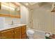 Clean and bright bathroom featuring a bathtub and shower, a toilet, and a vanity sink at 2131 E Rose Garden Ln, Phoenix, AZ 85024