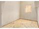 Unfinished bedroom with peeling paint and a window providing some natural light at 2131 E Rose Garden Ln, Phoenix, AZ 85024
