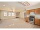 An open kitchen and living area, with potential for improvements and redesign at 2131 E Rose Garden Ln, Phoenix, AZ 85024