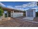 Backyard view with a storage shed, a white fence, and an attached patio at 228 N 65Th Pl, Mesa, AZ 85205