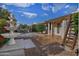 Backyard view featuring water fountain, tiled patio and lush landscaping at 228 N 65Th Pl, Mesa, AZ 85205