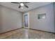 Bedroom with door and small windows and neutral wall at 228 N 65Th Pl, Mesa, AZ 85205