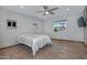 Bedroom with neutral walls, tile floor, ceiling fan and large windows for lots of natural light at 228 N 65Th Pl, Mesa, AZ 85205
