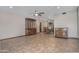 Spacious living room with tile flooring, ceiling fans, and elegant wood furniture at 228 N 65Th Pl, Mesa, AZ 85205