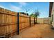 Fenced backyard with wood fence, block wall, and gate at 2320 W El Alba Way, Chandler, AZ 85224