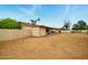 Large backyard with block wall, shade structure, drought-resistant plants and plenty of room at 2320 W El Alba Way, Chandler, AZ 85224