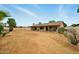 Expansive backyard featuring a covered patio, mature landscaping, and plenty of open space at 2320 W El Alba Way, Chandler, AZ 85224
