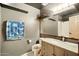 Modern bathroom featuring a vanity with granite countertop, large mirror, and a shower at 2320 W El Alba Way, Chandler, AZ 85224
