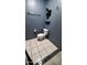 Bathroom featuring toilet, shelving, and tiled floors at 2320 W El Alba Way, Chandler, AZ 85224