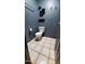 Bathroom featuring toilet, shelving, and tiled floors at 2320 W El Alba Way, Chandler, AZ 85224