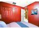 Bedroom with ample closet space, mounted television, and bright color scheme at 2320 W El Alba Way, Chandler, AZ 85224