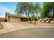 Inviting front exterior of a brick home featuring a well-manicured lawn and an attached garage at 2320 W El Alba Way, Chandler, AZ 85224