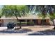 Charming single-story home with mature trees and a well-maintained xeriscaped front yard at 2320 W El Alba Way, Chandler, AZ 85224