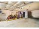 Garage interior with motorcycle, door, and storage space at 2320 W El Alba Way, Chandler, AZ 85224