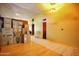 Hallway filled with stacked moving boxes, featuring wood and tile flooring at 2320 W El Alba Way, Chandler, AZ 85224