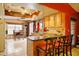 Inviting kitchen with a breakfast bar, tile flooring and an adjacent dining area filled with natural light at 2320 W El Alba Way, Chandler, AZ 85224