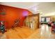 Wide view of a spacious living area with wood and tile flooring, filled with packed moving boxes at 2320 W El Alba Way, Chandler, AZ 85224