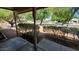 Inviting covered porch view with decorative columns and manicured hedges framing the home at 2320 W El Alba Way, Chandler, AZ 85224