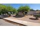 Drought-tolerant landscaping and greenery offer a peaceful ambiance to this side yard view at 2320 W El Alba Way, Chandler, AZ 85224