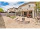 Spacious backyard featuring a cozy fire pit and covered patio, perfect for outdoor entertaining at 2331 E Sunland Ave, Phoenix, AZ 85040