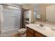 Charming bathroom with a shower-tub combination, vanity, and ample storage space, providing convenience and comfort at 2331 E Sunland Ave, Phoenix, AZ 85040