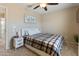 Inviting bedroom with a comfortable bed, stylish bedside tables, and a ceiling fan for added comfort at 2331 E Sunland Ave, Phoenix, AZ 85040