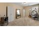 Spacious bedroom with unique decor, including a hanging chair and guitar, creating a stylish and relaxing retreat at 2331 E Sunland Ave, Phoenix, AZ 85040
