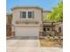 Charming two-story home featuring a two-car garage and inviting front yard landscaping at 2331 E Sunland Ave, Phoenix, AZ 85040