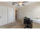 Functional office with a large closet, desk, and comfortable chair, designed for an efficient workspace at 2331 E Sunland Ave, Phoenix, AZ 85040