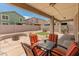 Inviting covered patio with outdoor seating, ideal for relaxing and enjoying the backyard view at 2331 E Sunland Ave, Phoenix, AZ 85040